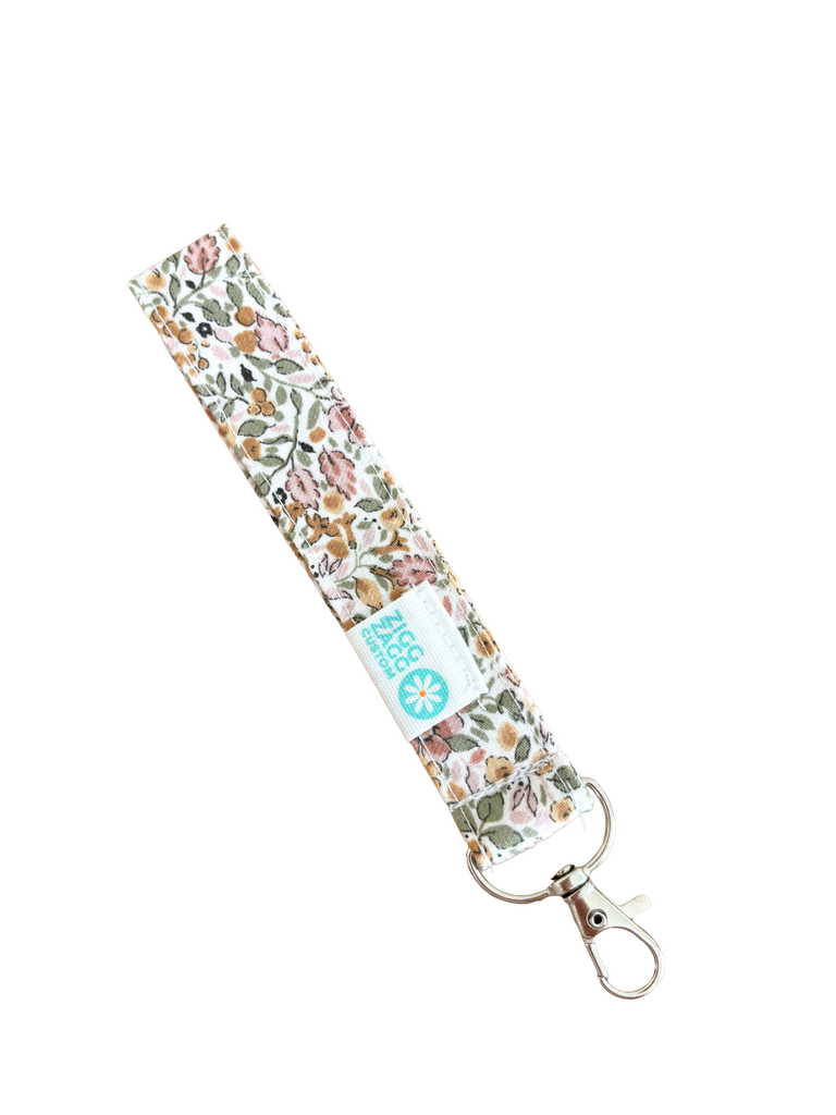 Llavero flores Champán